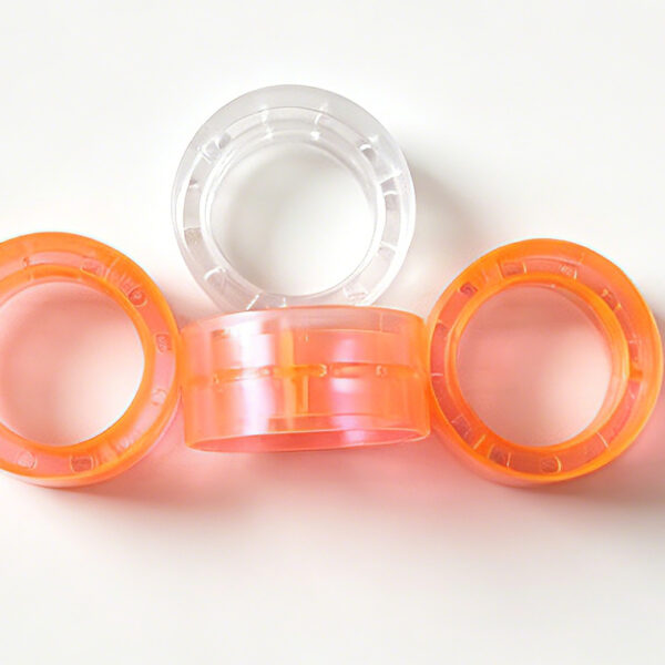 Super clear colored plastic tape cores for stationery tape rolls, orange and clear translucent plastic spools